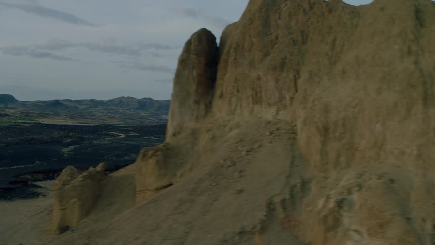 Tall rock formations and muddy land