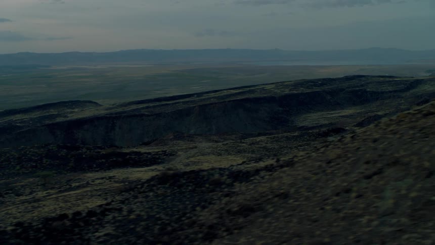 The hills lead to a range in the distance