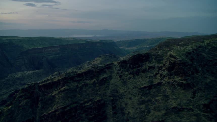 Tall mountains cover the landscape