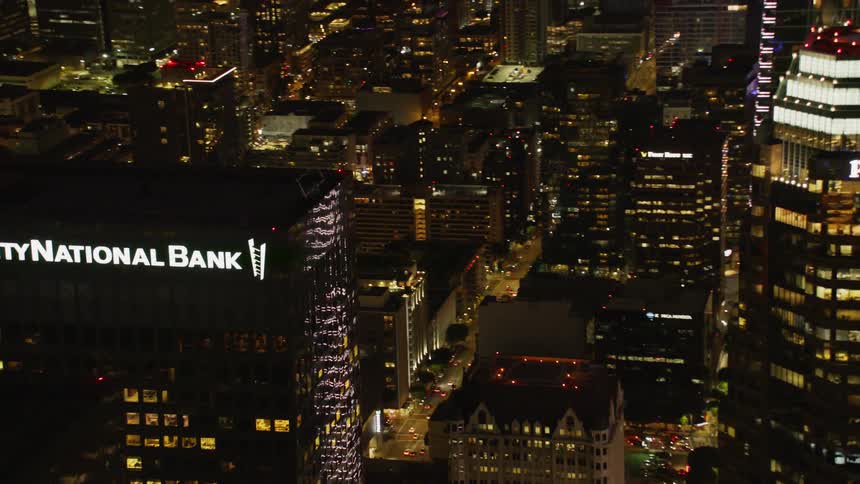 City buildings illuminate the night sky