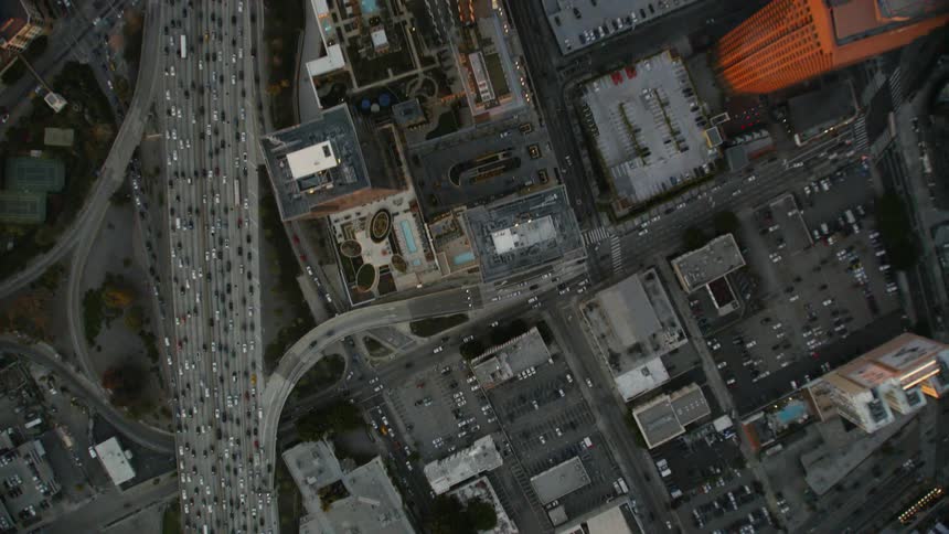 The roads running through the city below have heavy traffic