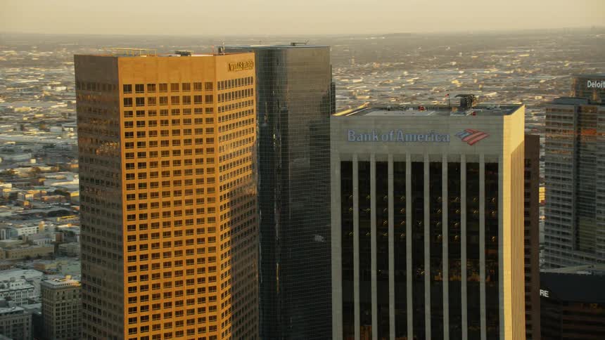 The sun reflects off the tall buildings in the city
