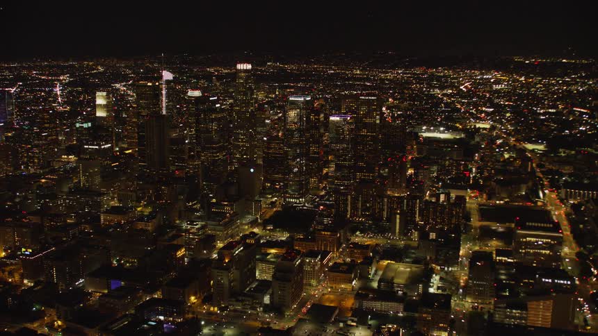 The city is brightly lit at night; Los Angeles