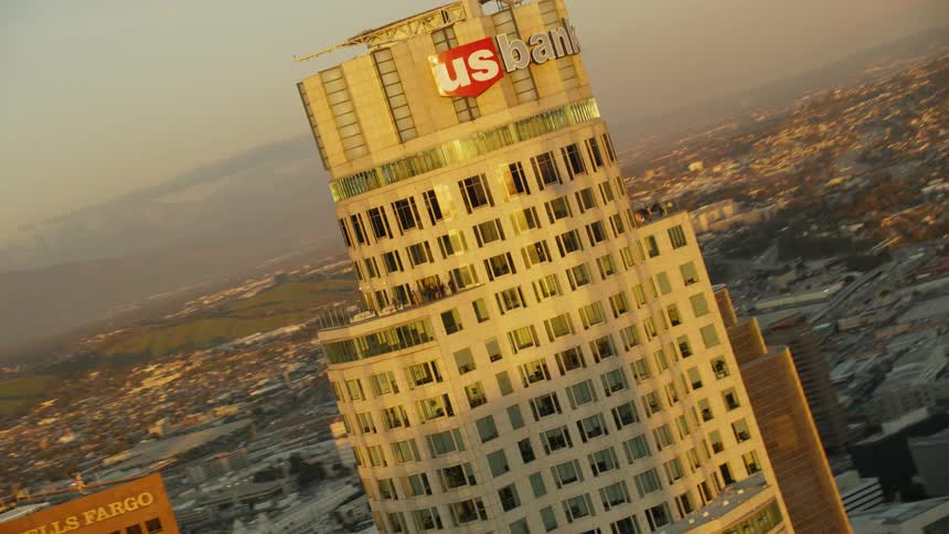 A tall city building towers into the sky