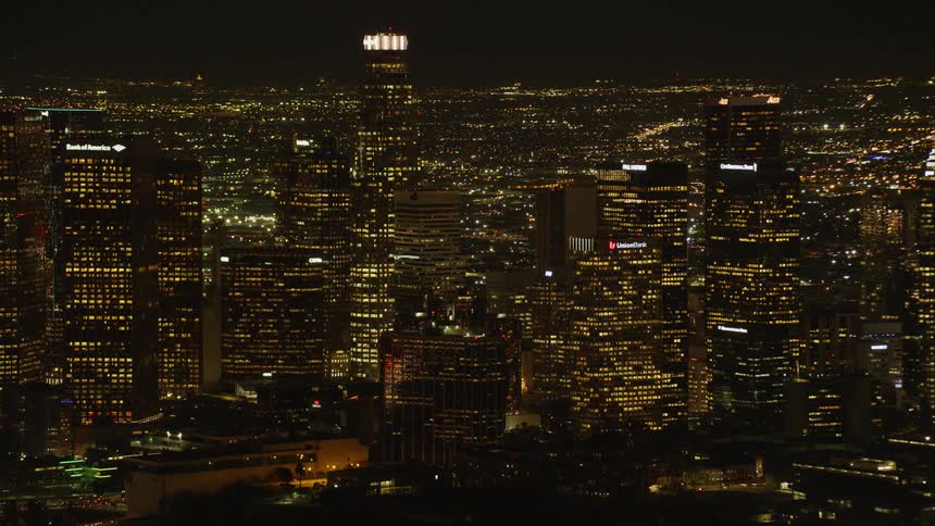 City buildings illuminate the night sky