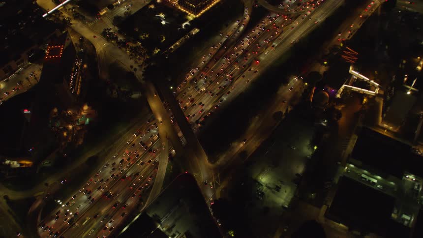 The busy freeways run through the city at night