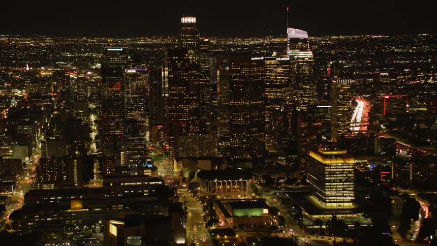 City buildings illuminate the night