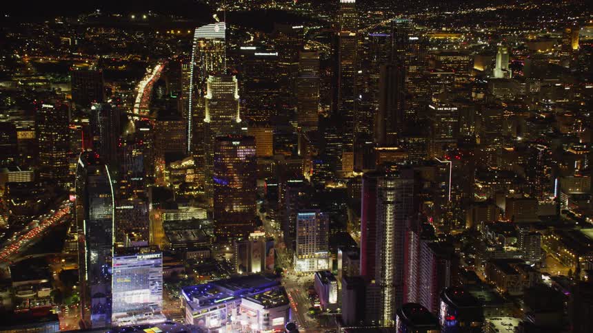 City buildings illuminate the night sky