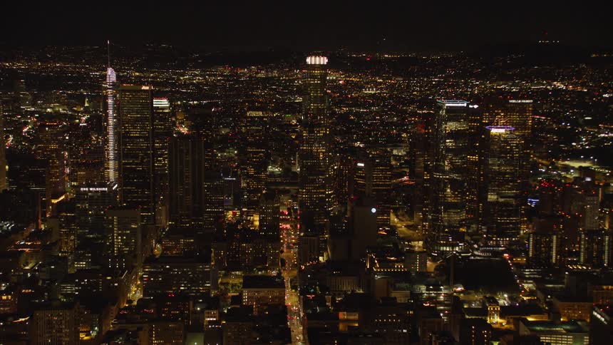City buildings illuminate the night sky