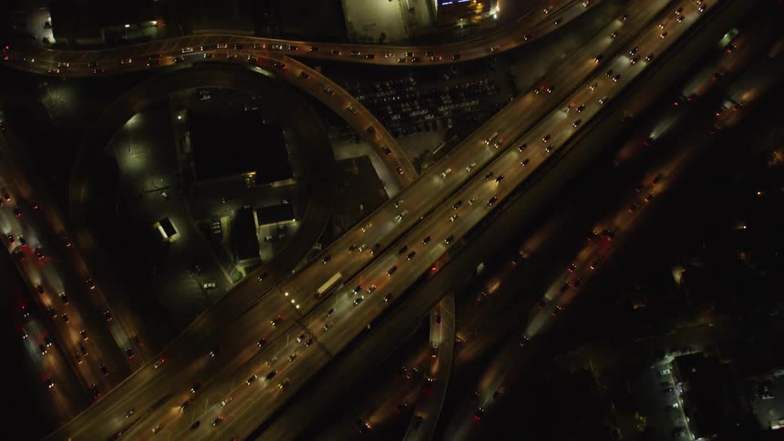 Heavy traffic travels over the city highways and overpasses