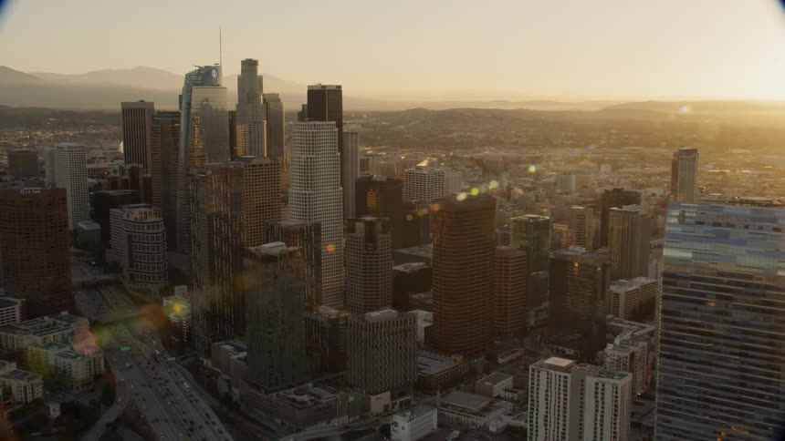 Tall city buildings tower into the skyline, DTLA