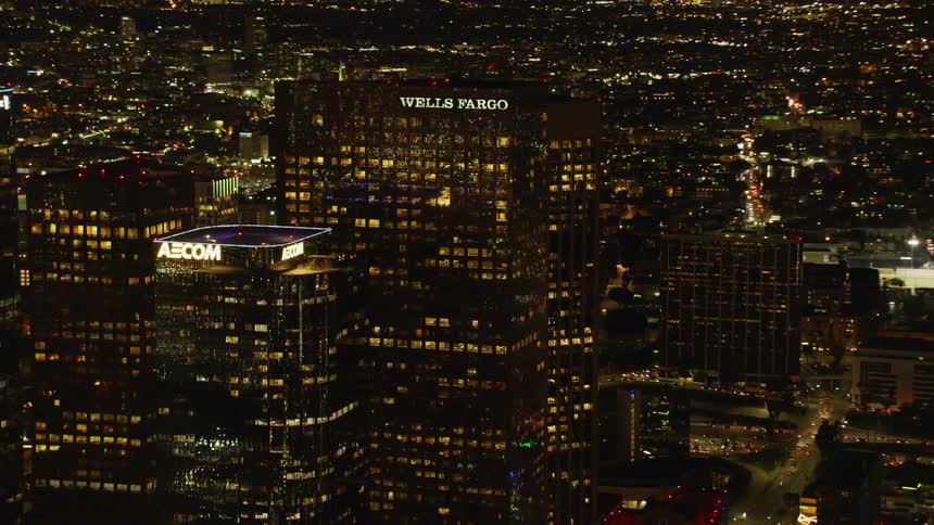 City skyscrapers illuminate the night sky