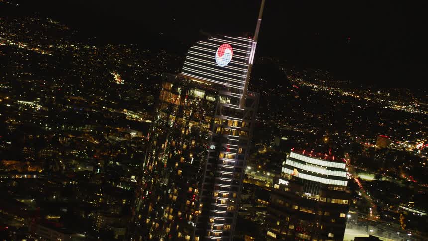 Tall skyscrapers above a city lit up at night