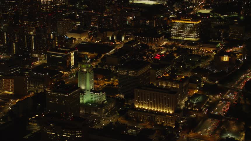 Buildings stand in a city at night