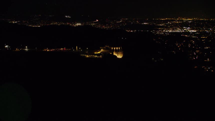 On the hill the stone wall is lit at night
