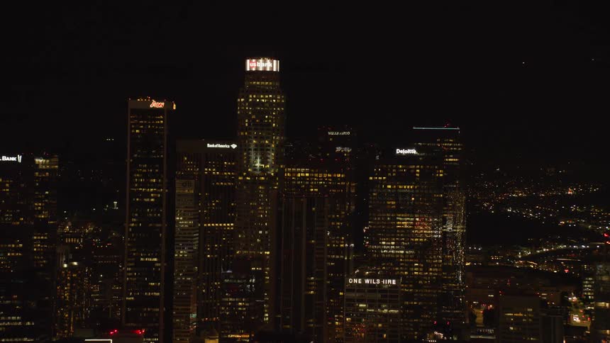 Skyscrapers stand in a city at night