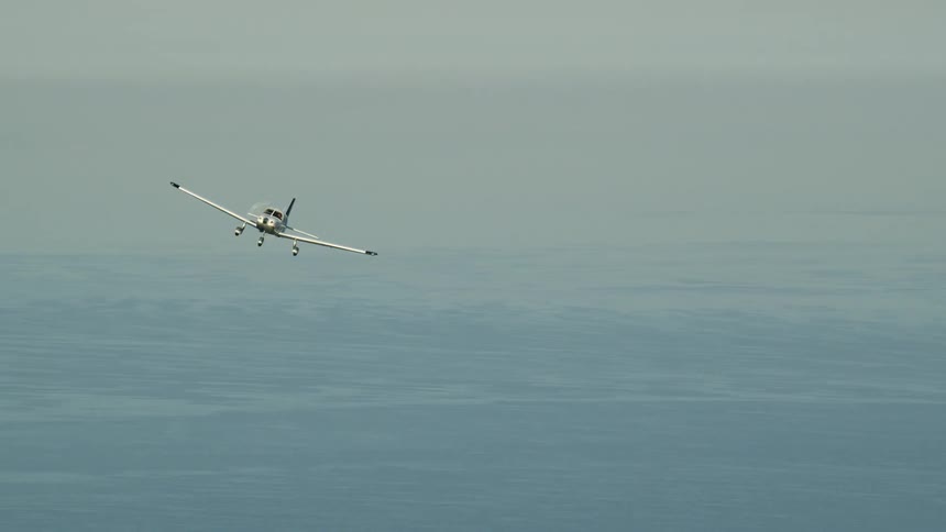 A small plane flies in the sky
