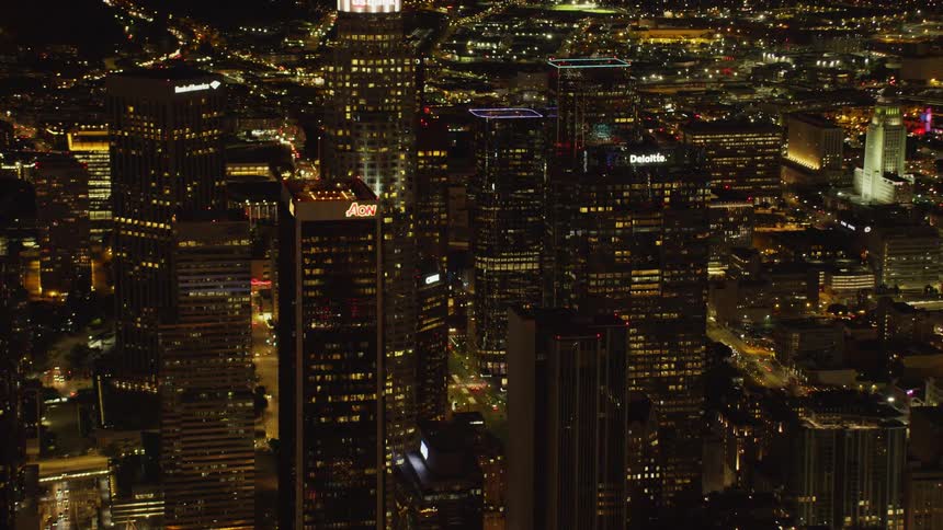 Large city with many tall buildings lit up at night; Los Angeles Skyline