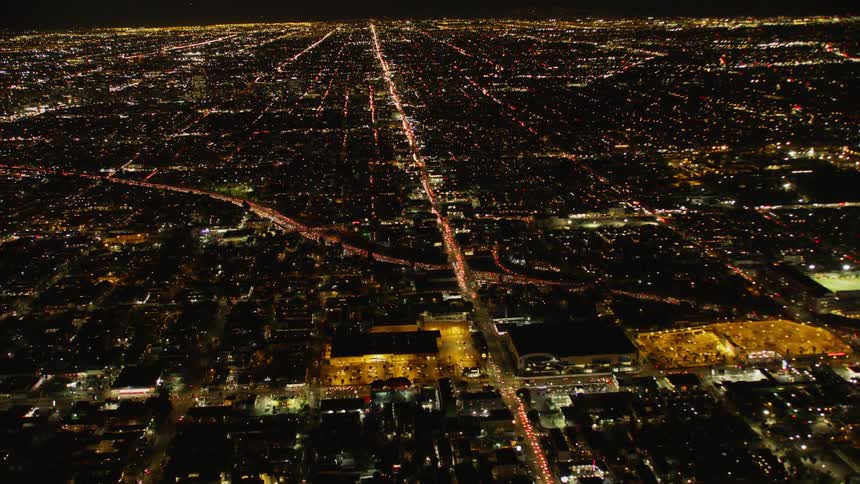 The large city is brightly lit at night