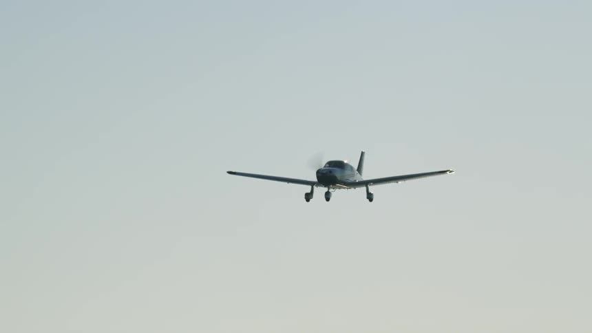 A small plane flies in the sky