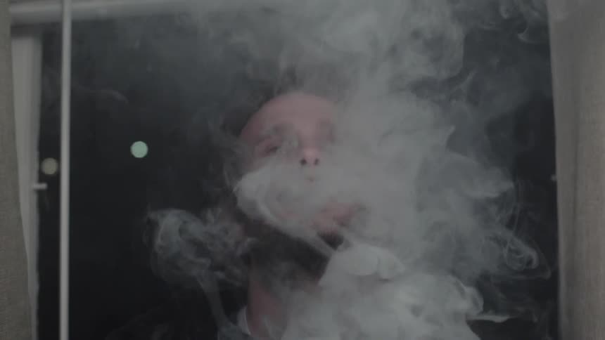 A man is smoking weed