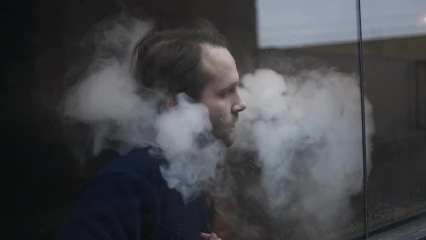Man has smoke coming out of his clothes