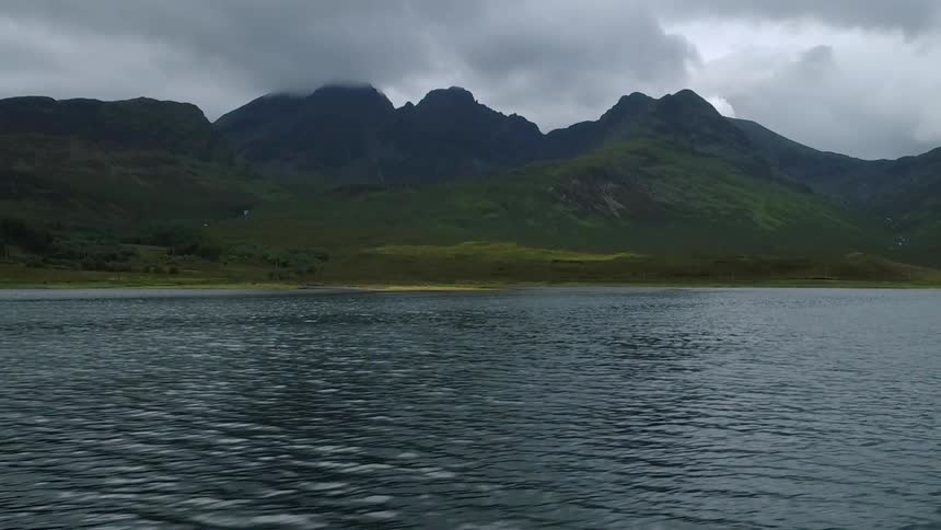 The ocean tide is rippling off a remote coastline on a cloudy day