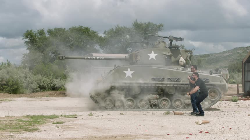 People fire off a tank creating smoke