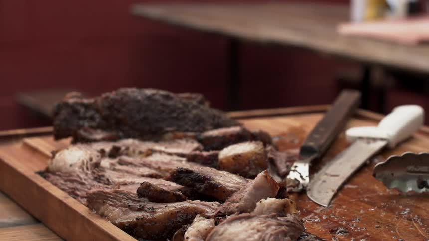 Meat sits on a wood cutting board