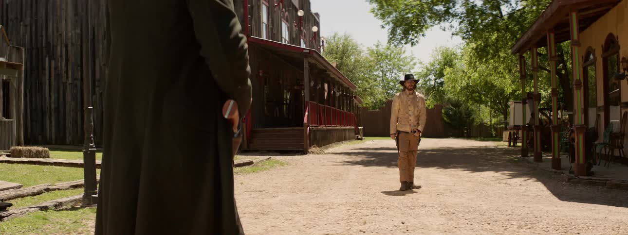 Two gunslingers begin a stand off