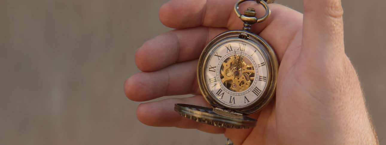 A person holds a pocket watch