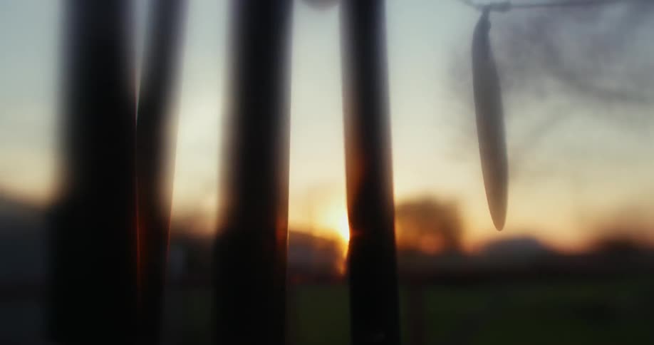 A wind chime sways in the breeze