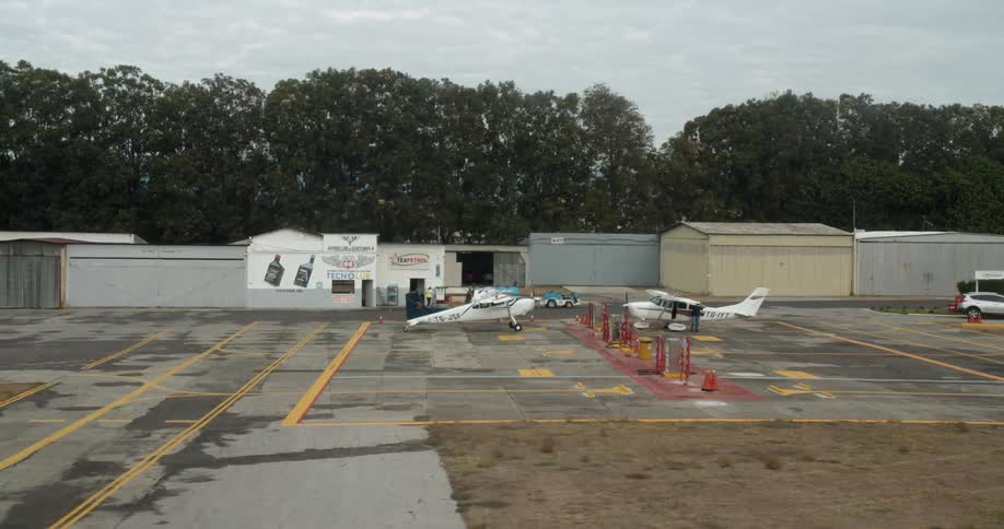 Several small planes in a small airport