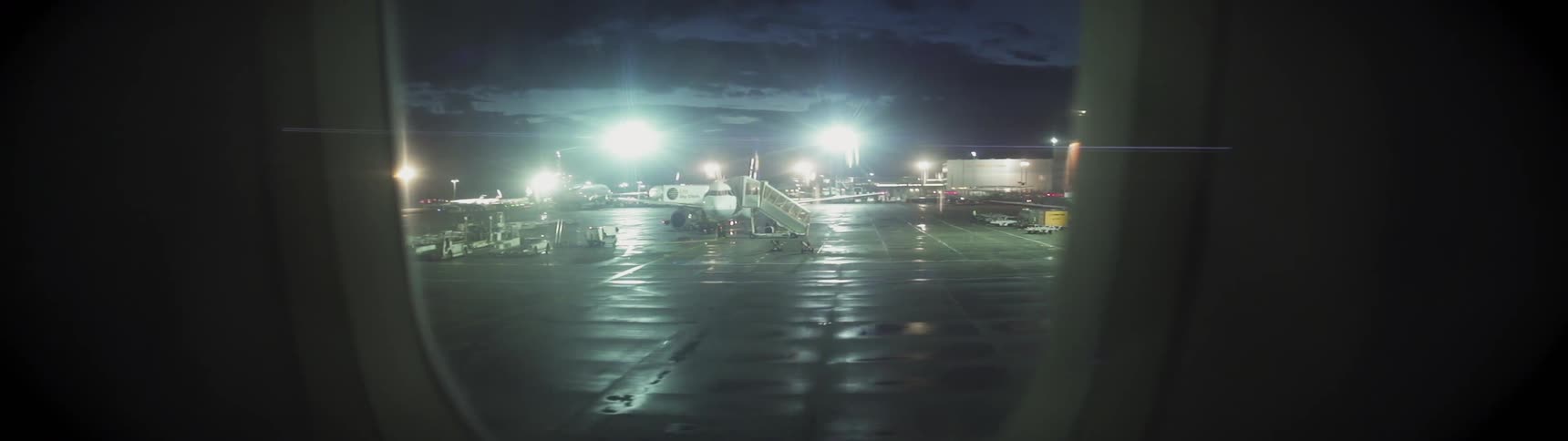 The plane begins taking off from the runway at night
