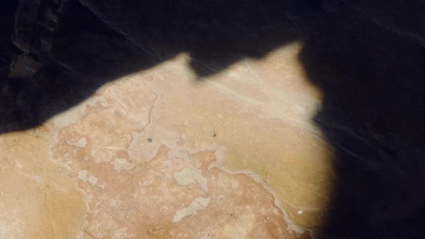 The sun is creating shadows in the cave