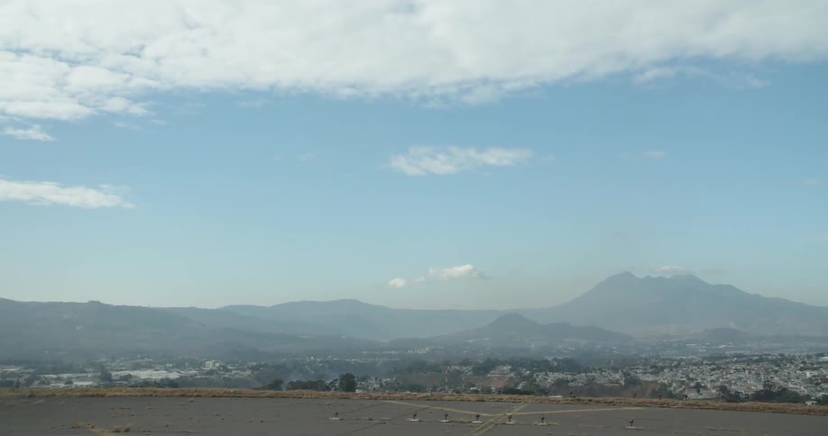 The town leads to the mountains in the distance