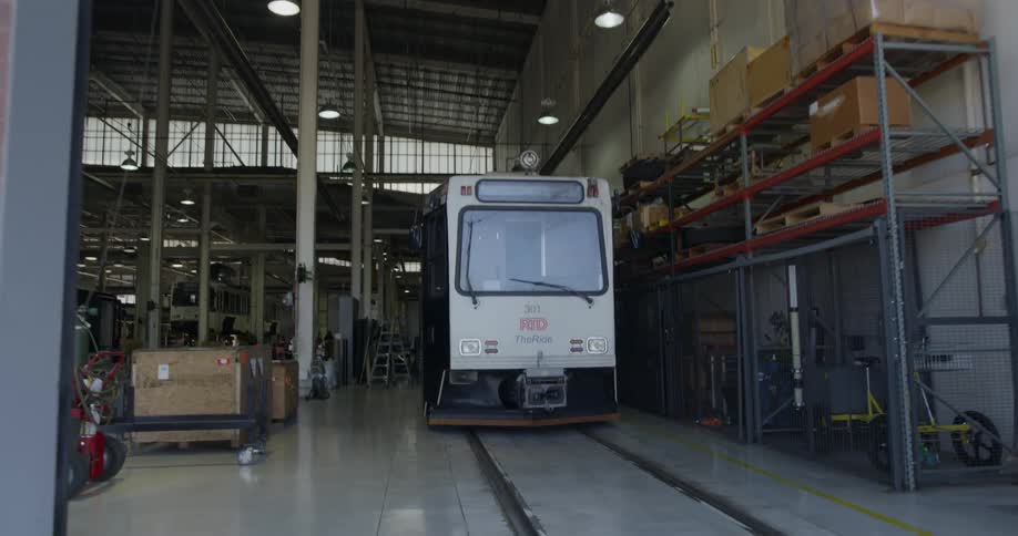 Trolley car sits inside a large building