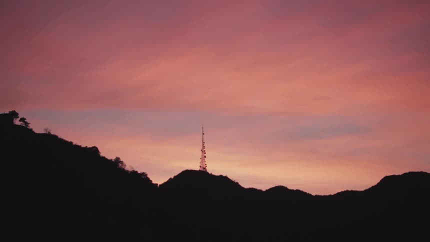 A silhouetted hill at sunset