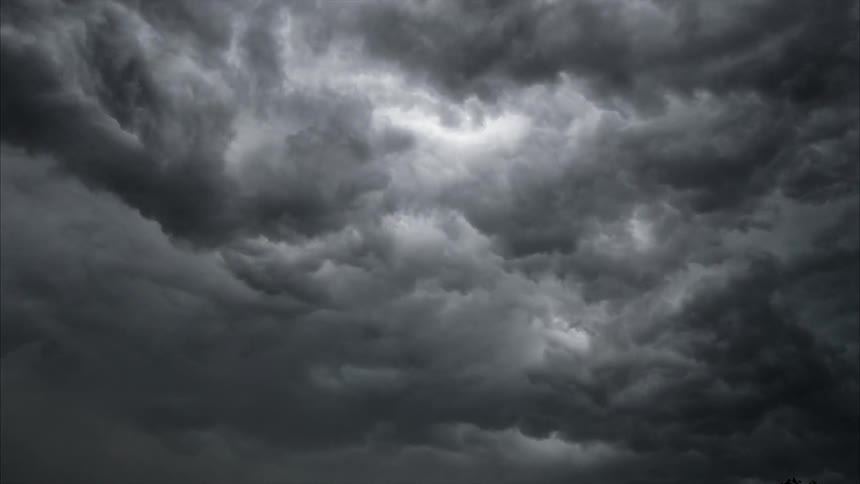 The large storm clouds move across the sky