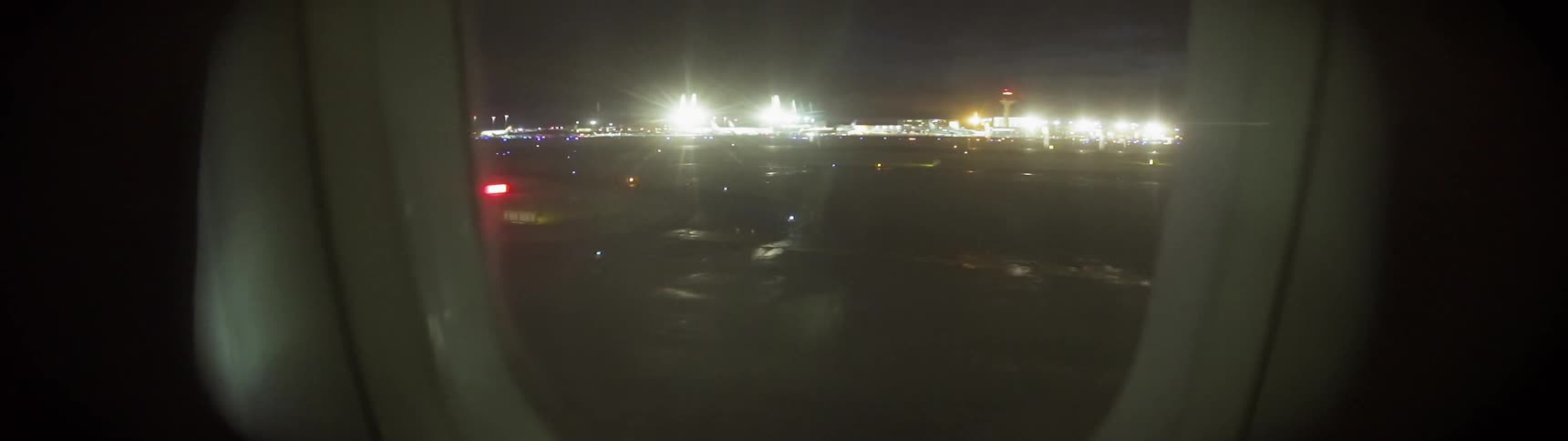Airplane takes off from a city at night