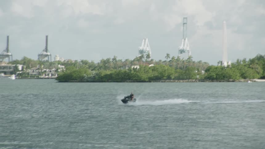 A person rides a jet ski