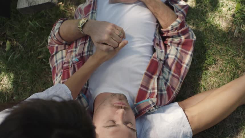 A man is laying his head in a womans lap