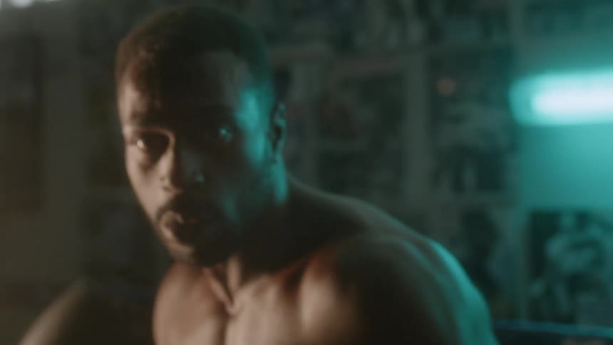 A boxer punches the air