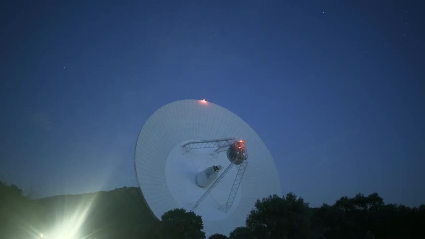 The satellite dish is pointing forward on the hill