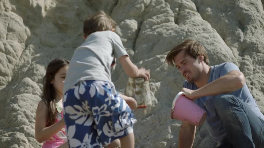 A man plays with his family