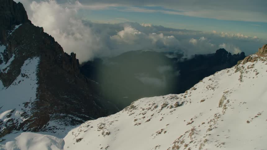 The mountain range is covered with snow and ice