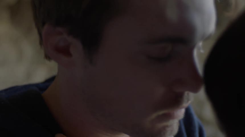 A man and woman kiss
