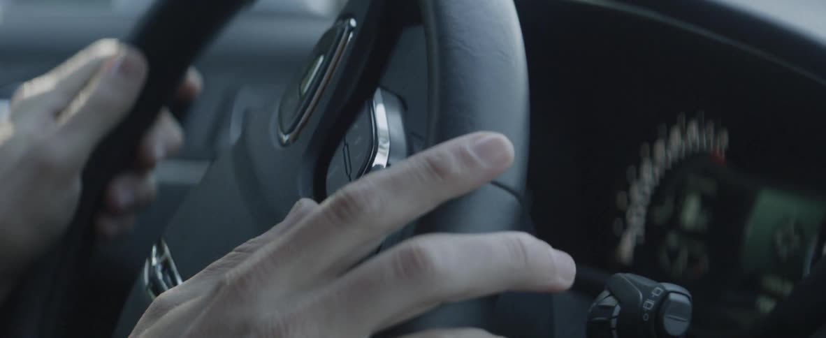 A driver turns the steering wheel