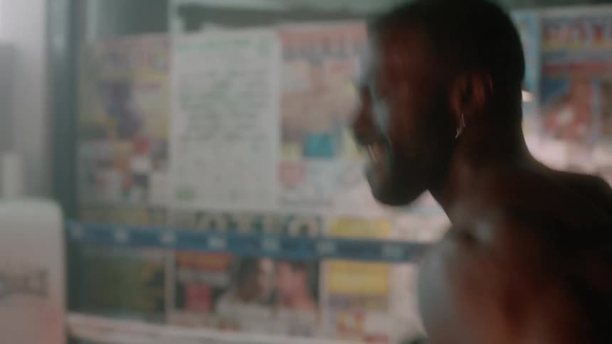Two men have a boxing match in the ring