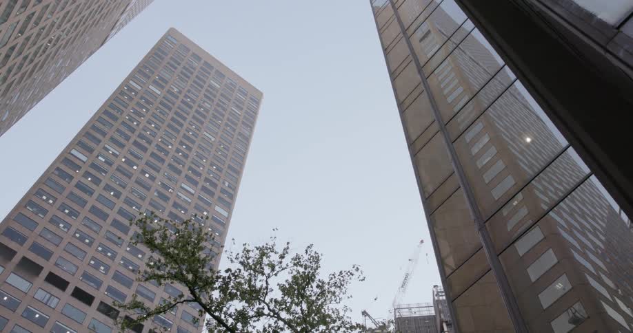 Looking up at skyscrapers from street level